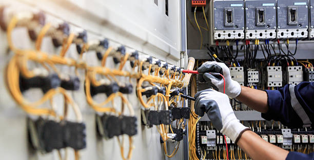 Professional Electrician technician working in Home Gardens, CA